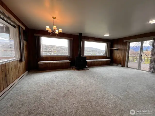 Family room and dining room space with amazing views of the river and mountains.