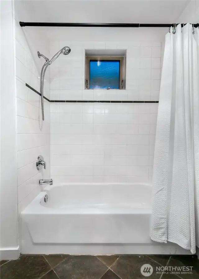 Two bedrooms with oversized windows and walk in closets are ideally positioned on opposite corners of the home for privacy —the owner’s suite with en suite bath and a second bedroom plus additional full bath.