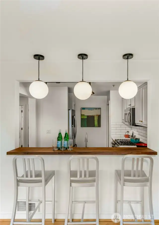 Bringing the outdoors in and the indoors out, this keenly designed residence delights in the best of both worlds. Pitch a hammock for two and unwind as the sunset paints the sky, cultivate a thriving urban garden, or dine al fresco with friends (including Fido) on the 450 SF private terrace. Your spacious outdoor oasis flows into a light-filled, south-facing living space with an enchanting fireplace, gleaming hardwoods, and a chef’s kitchen with 4-person eating bar, pantry and laundry. Two bedrooms with oversized windows and walk in closets are ideally positioned on opposite corners of the home for privacy —the owner’s suite with en suite bath and a second bedroom plus additional full bath.