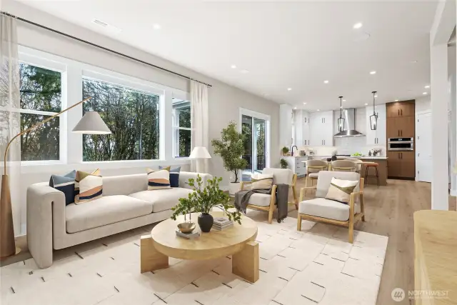 The living area looks out to a verdant greenbelt area!