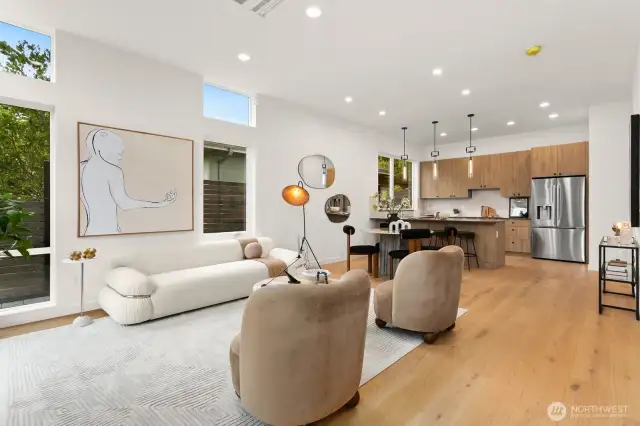 Lovely wide planked engineered hardwoods throughout the main living level. The chef kitchen has an island kitchen. Not shown in the photo, there's also a half bath and sitting nook area on the main floor.