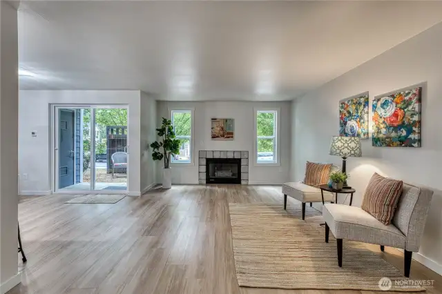 Fantastic great room with new vinyl windows, flooring, paint. millwork and more. Enjoy the cozy gas fireplace or relax on the back patio area.