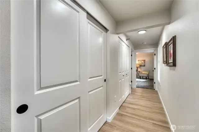 Hall with large entry and laundry closets.