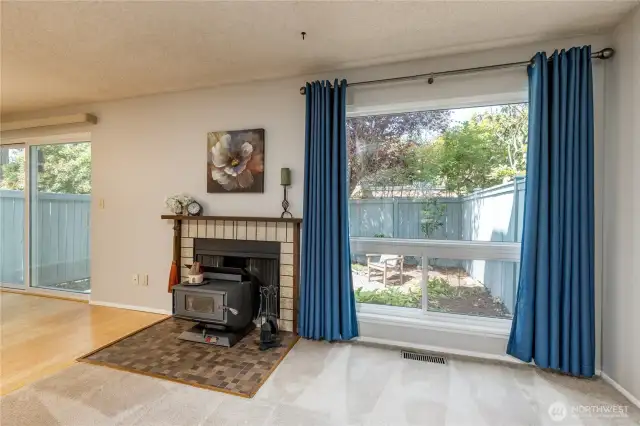 Large windows and a cozy wood stove