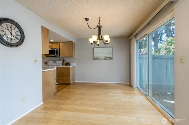 Dining room with slider to fully-fenced yard