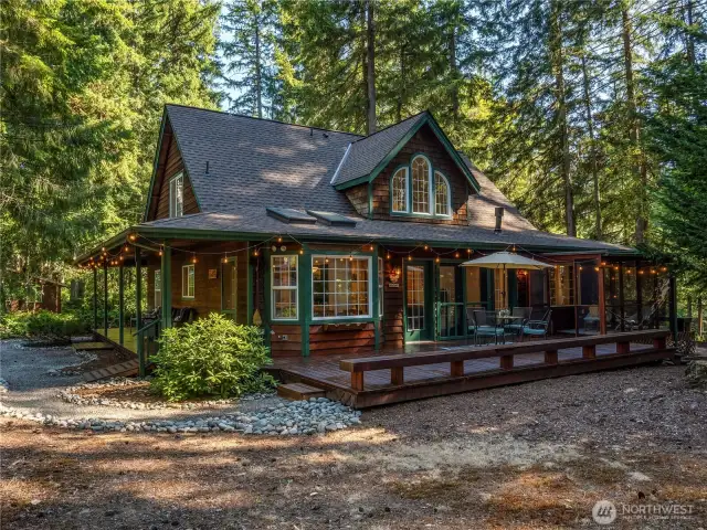 This home is nestled into the trees and just a short walk to the lake!