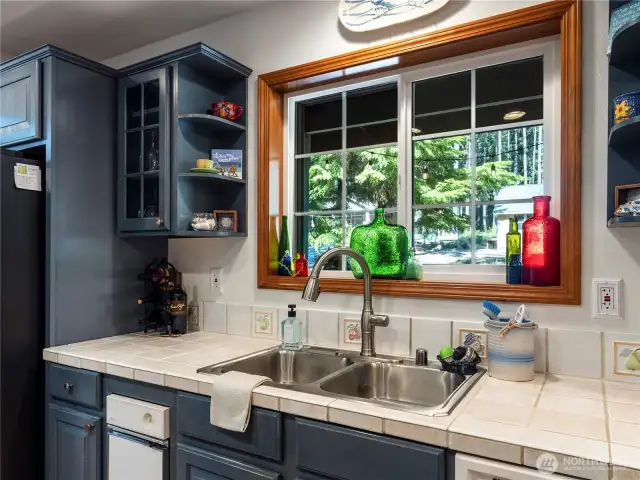 The kitchen has tons of storage and a large island with seating, making it perfect for gathering.