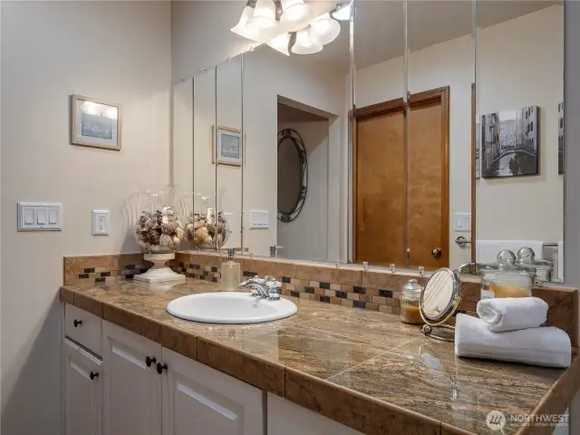 The primary suite bathroom is spacious and offers plenty of counter space and storage.
