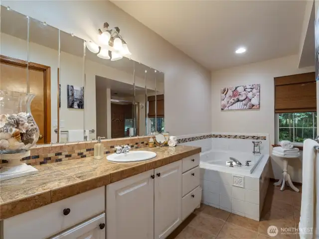 The primary bath features a Jacuzzi tub and a walk-in shower.