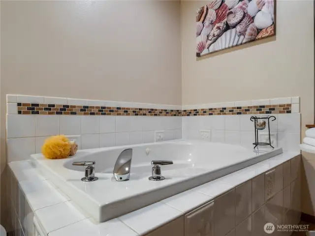 Relax on weekend mornings in this oversized Jacuzzi tub.