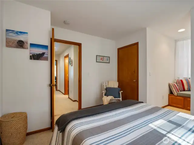 Both upstairs bedrooms have large windows and mirror each other's layout.