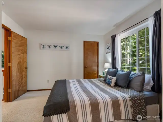 Both upstairs bedrooms have views of the woods through the windows.