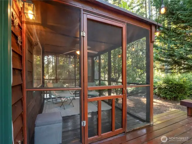 Off the back deck, you'll find the large screened-in sunroom that's made for lounging.