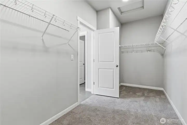 Spacious walk-in closet for the primary bedroom