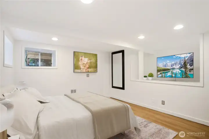 The 3rd bedroom is part of the lower-level suite.  This is accessed from a separate exterior door, offering the perfect guest space, WFH space, studio, or gym.  (Virtually staged)