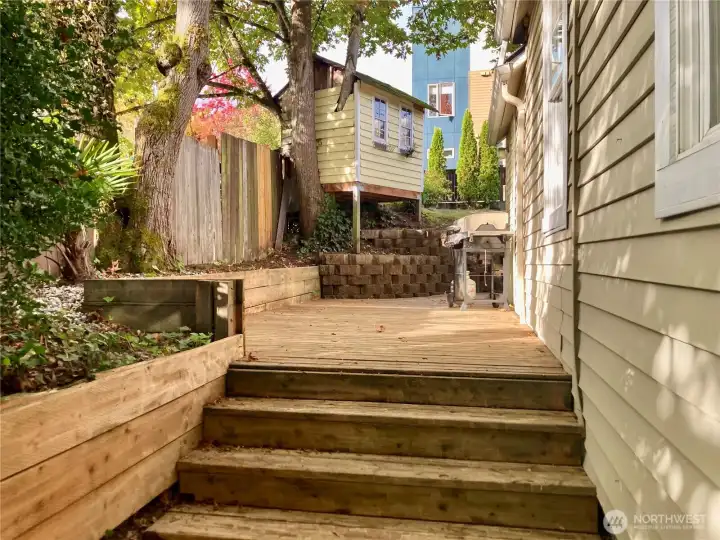 Privacy abounds on the private deck located on the south side of the home.  The perfect space to grill stay shaded in the summer.