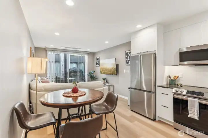 Space for a dining table in the kitchen opens to the cozy living room with slider to your deck.