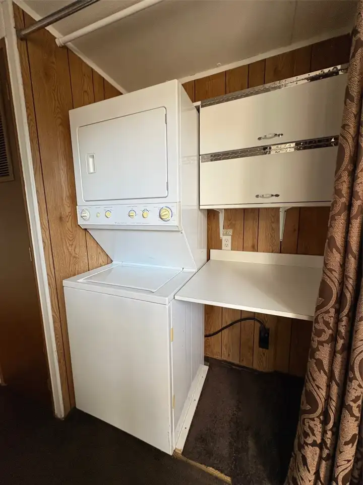 Laundry area with folding station and storage