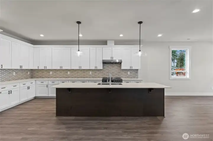 Light and bright kitchen with island large enough for 4+ seats