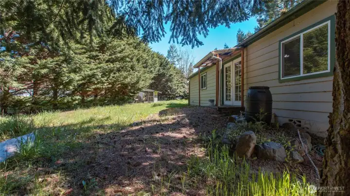 Back of main house with garden shed in the distance