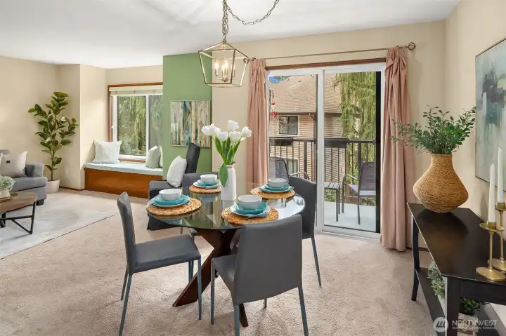 Dining area with access to view balcony.