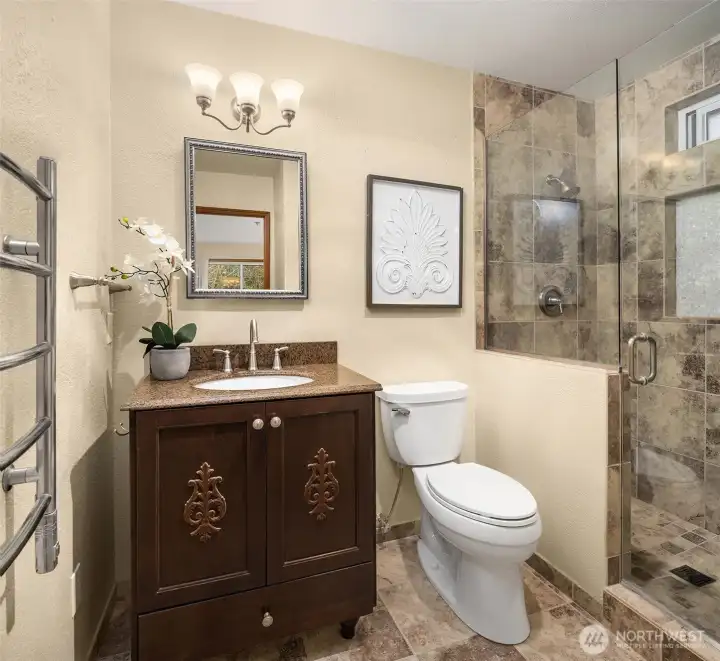 Fully Remodeled Primary Bath with walk-in shower and custom tile.