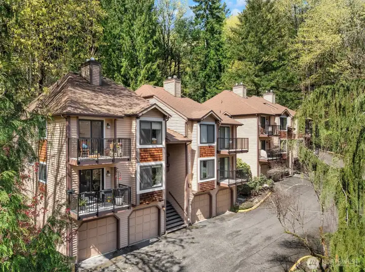 End unit with beautiful and peaceful views of the surrounding woodlands.