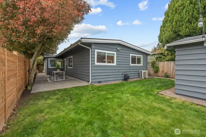 back yard facing dining patio and house