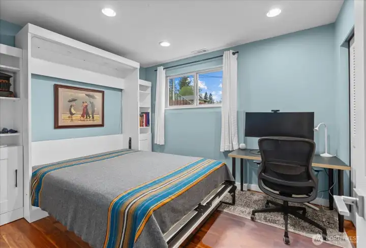 The 4th bedroom doubles as an office and guest room with a built-in murphy bed which stays for the buyer