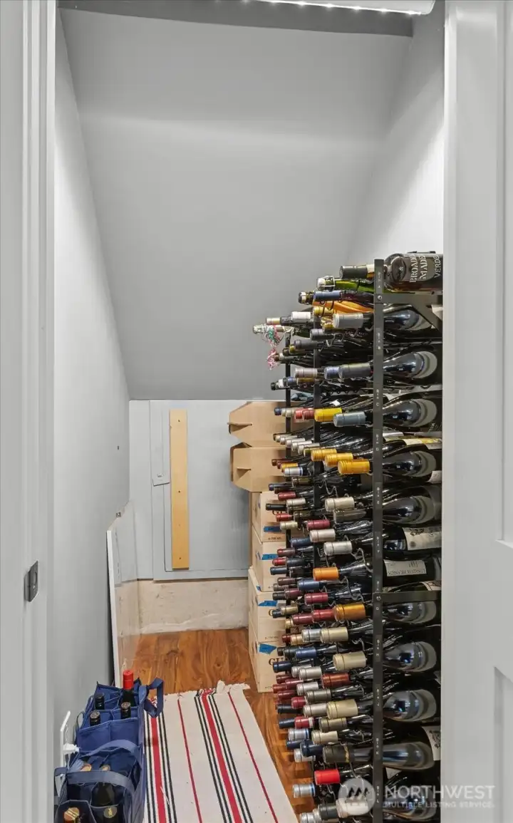 The generous under stair closet is a perfect place for your extra wine storage