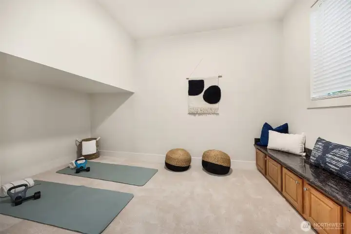 Additional highlights include a large laundry room with adjoining studio space featuring custom built-ins and granite slab (endless possibilties - home gym, playroom, office, art, Yoga or meditation studio).
