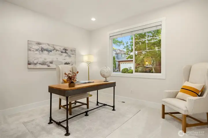 The light, bright and spacious den, located on the mainlevel is the perfect work from home space.