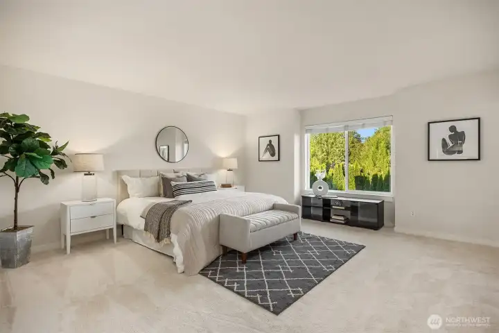 Enjoy Mt. Si views from the private, fenced backyard and from the spacious primary suite, complete with French doors, a soaking tub, separate vanities, tile flooring, and a generous walk-in closet.