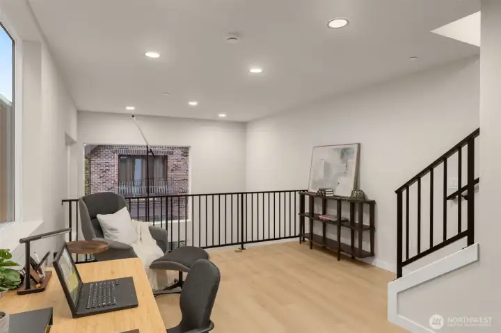 Expansive upper-level loft space, perfect for a media room, secondary lounge, or open-concept library overlooking the main landing. Expansive upper-level loft space, perfect for a media room, secondary lounge, or open-concept library overlooking the main landing.