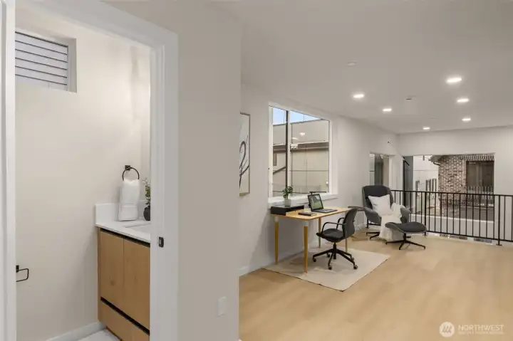 Versatile upper-level bedroom or home office flooded with natural light from large, energy-efficient windows. Versatile upper-level bedroom or home office flooded with natural light from large, energy-efficient windows.