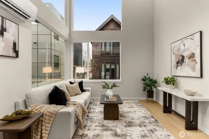 Showcase of the magnificent living area, featuring soaring double-height ceilings, walls of glass, and high-end contemporary finishes. Showcase of the magnificent living area, featuring soaring double-height ceilings, walls of glass, and high-end contemporary finishes.