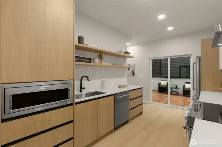 Extensive built-in storage, seamless integrated microwave, and floating display shelving. Extensive built-in storage, seamless integrated microwave, and floating display shelving.