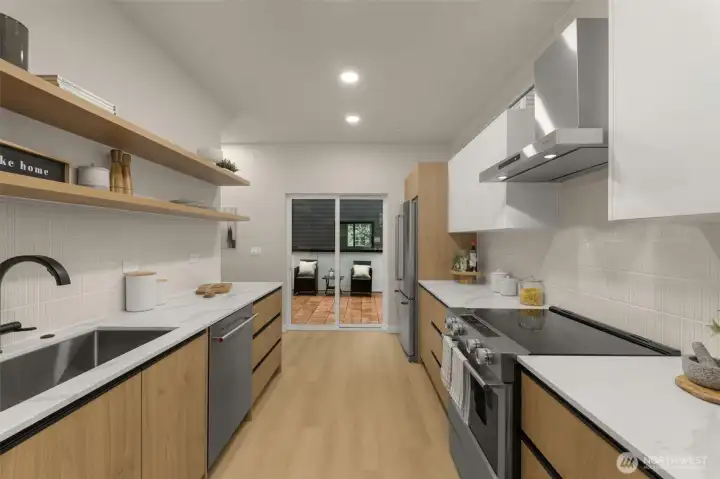 A straight-on view of the long, functional kitchen layout, highlighting the beautiful light oak-toned flooring and crisp white upper cabinets. A straight-on view of the long, functional kitchen layout, highlighting the beautiful light oak-toned flooring and crisp white upper cabinets.
