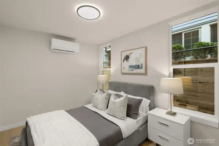 Another bright, well-appointed bedroom featuring efficient mini-split climate control Another bright, well-appointed bedroom featuring efficient mini-split climate control
