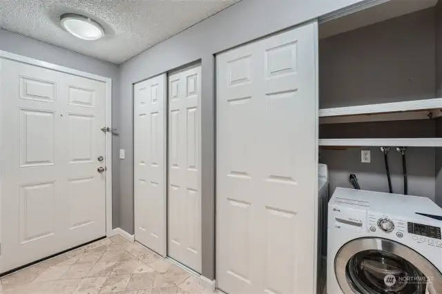 Coat closet and convenient in-unit laundry closet with a new washer and dryer, off the entry.