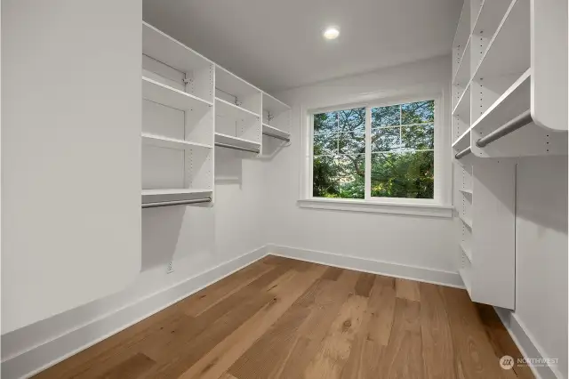 Primary bedroom walk-in closet