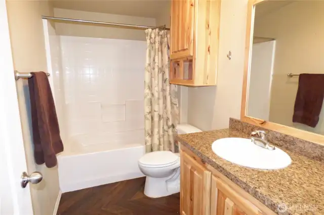 Full bathroom located by bedrooms 1 and 2.