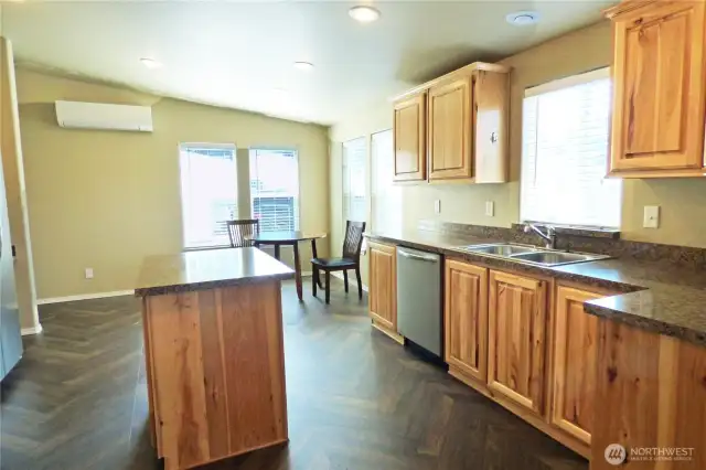 Large kitchen with lots of counters and cabinets. Notice the ductless mini-split (heat and a/c).