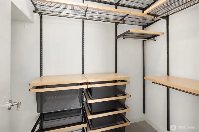 Large walk-in closet with customized shelving.