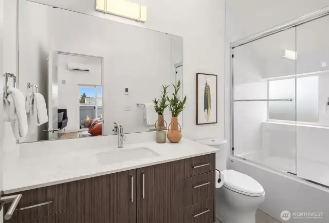 Second bathroom with tub.