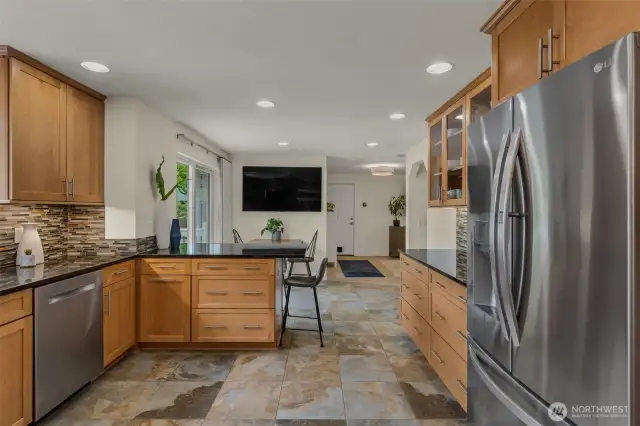 Spacious eat-in kitchen and appliances 2-3 years old including refrigerator, stove/oven, and ultra quiet dishwasher.