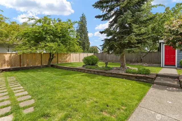 Level lot offers perfect play and garden space.
