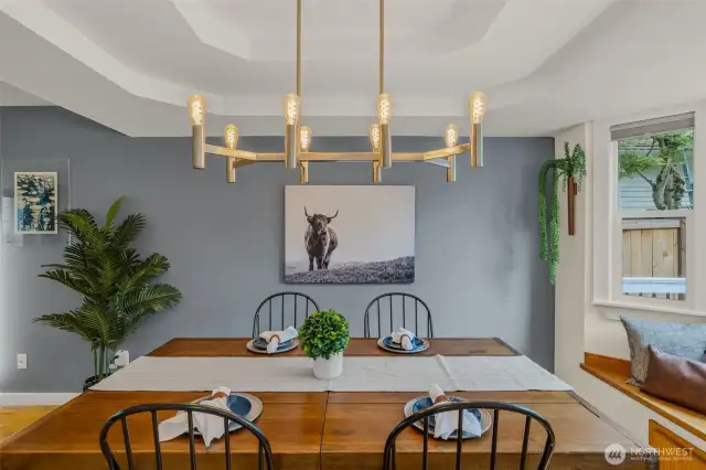 Dining area with backyard facing bay window and built-in seat. access to kitchen.