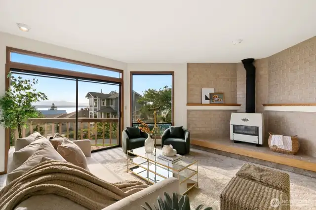 Formal dining & living facing Western Sound & Mountain Views, opening to deck