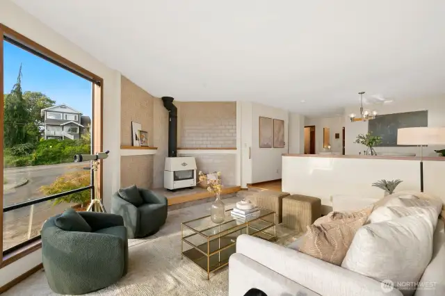 Formal dining & living facing Western Sound & Mountain Views, opening to deck
